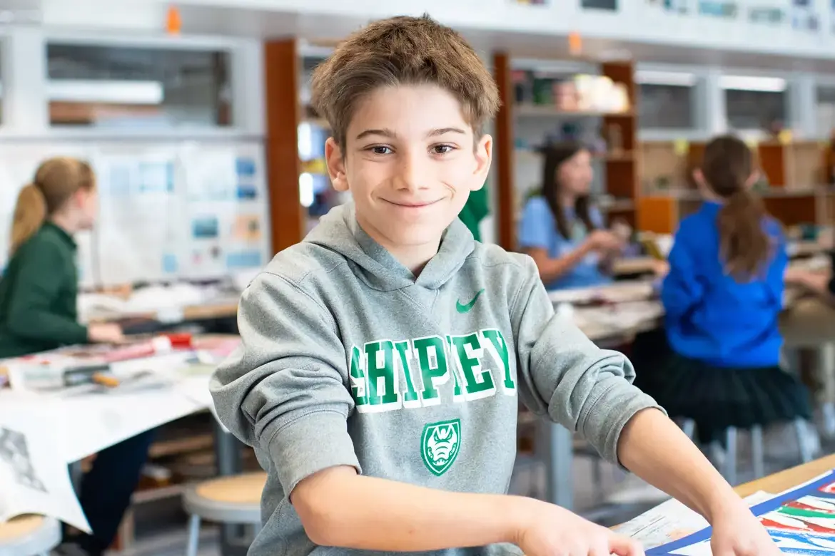 Student in art class smiling