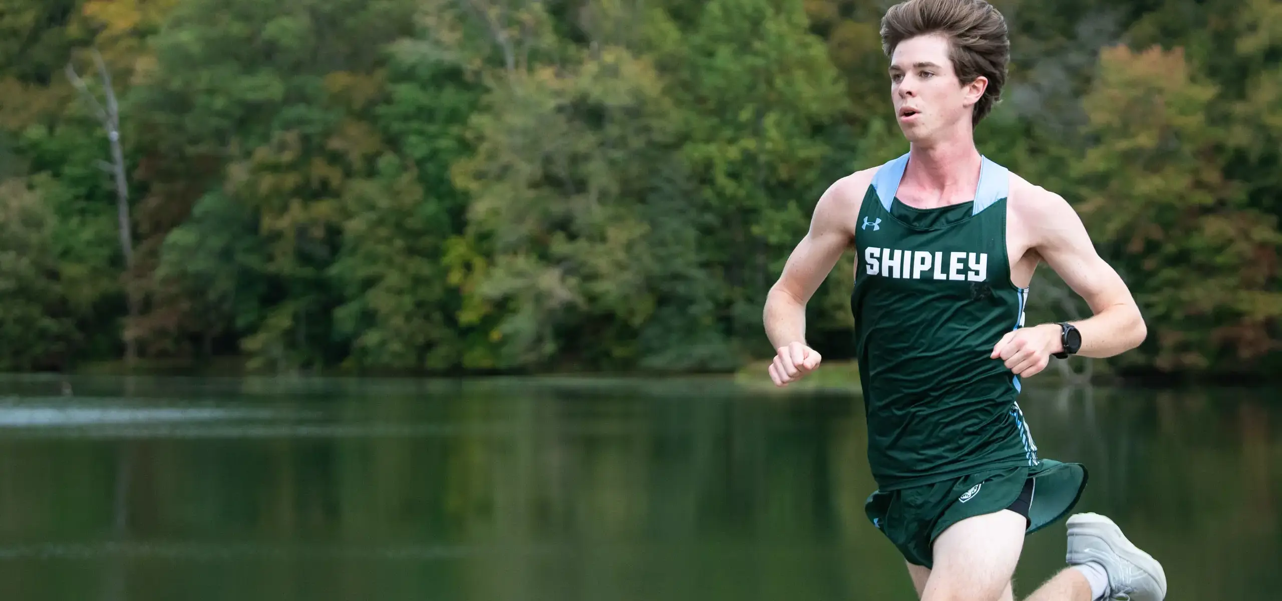 Student running track