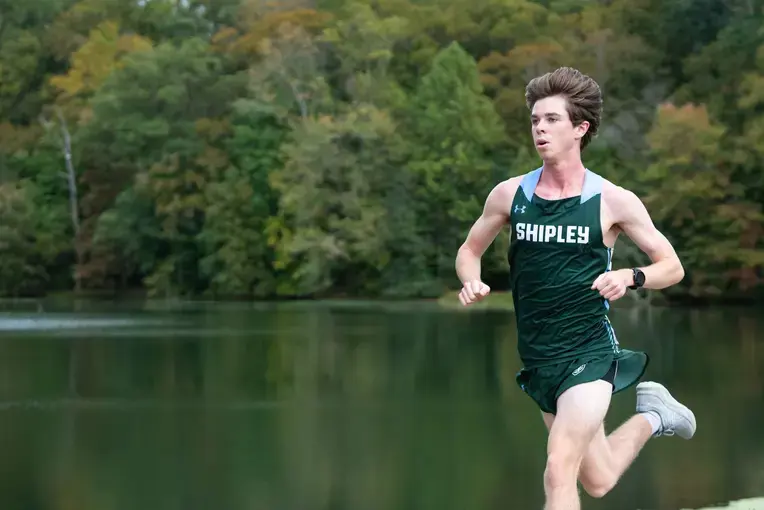 Student in shipley jersey running