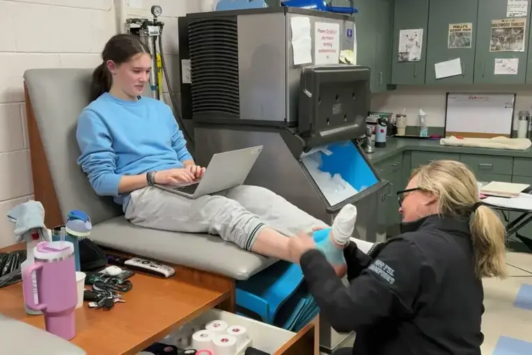 Students performing sports medicine practice