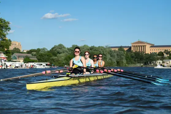 Students rowing out on water
