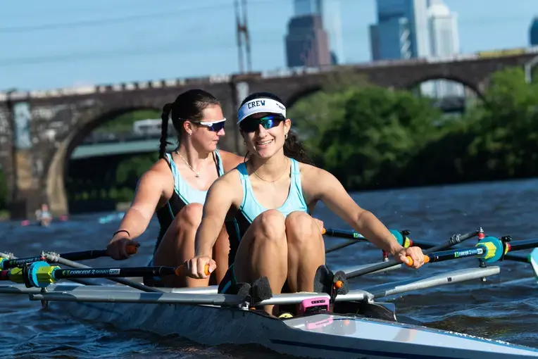 Students rowing in boat