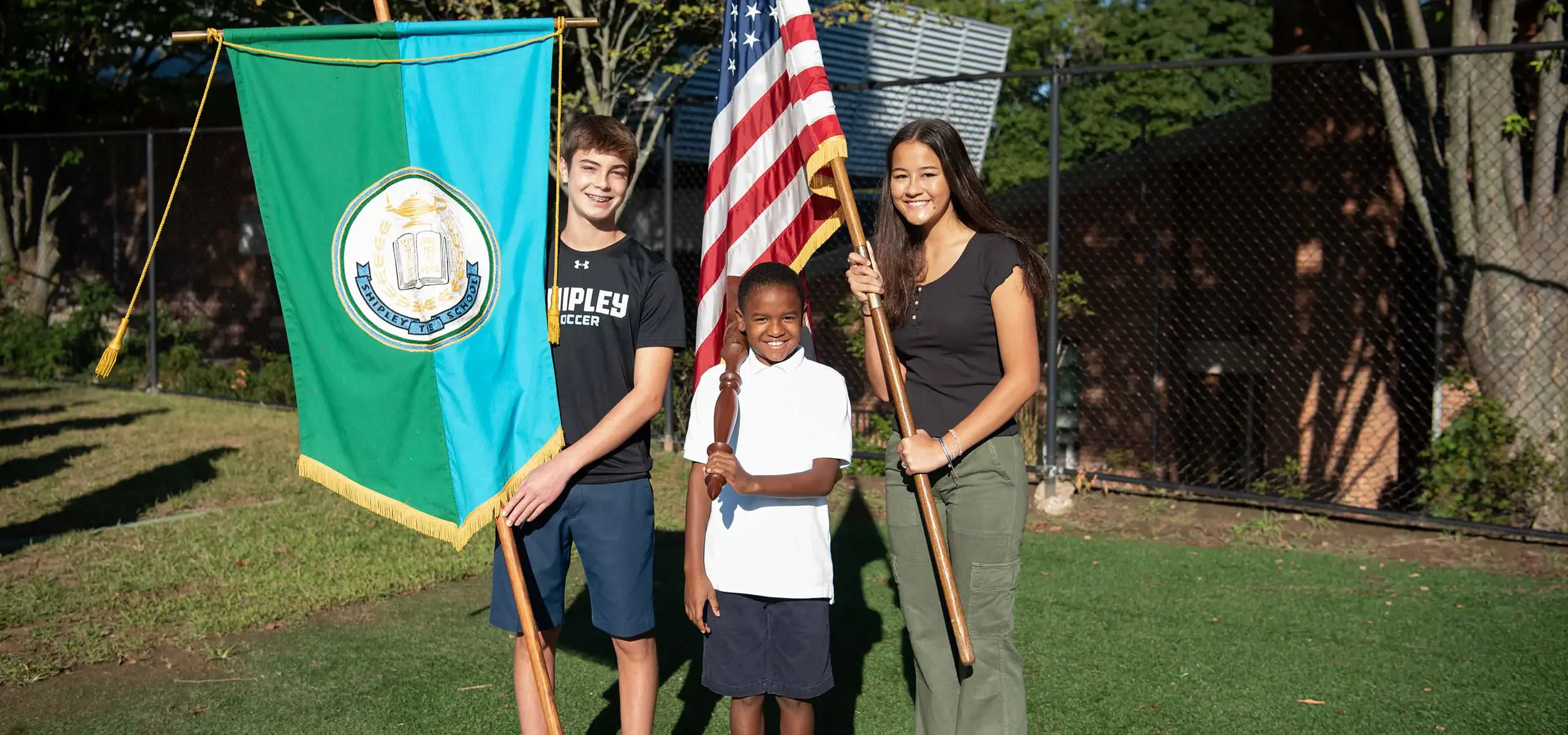 Students holding various flags