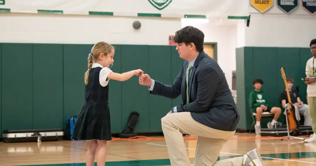 Lower and upper school student in gymnasium