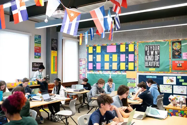 Students in classroom with country flags