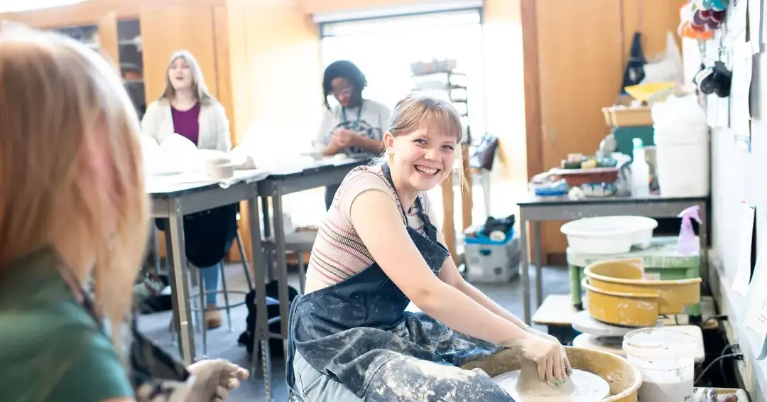 Student in pottery class