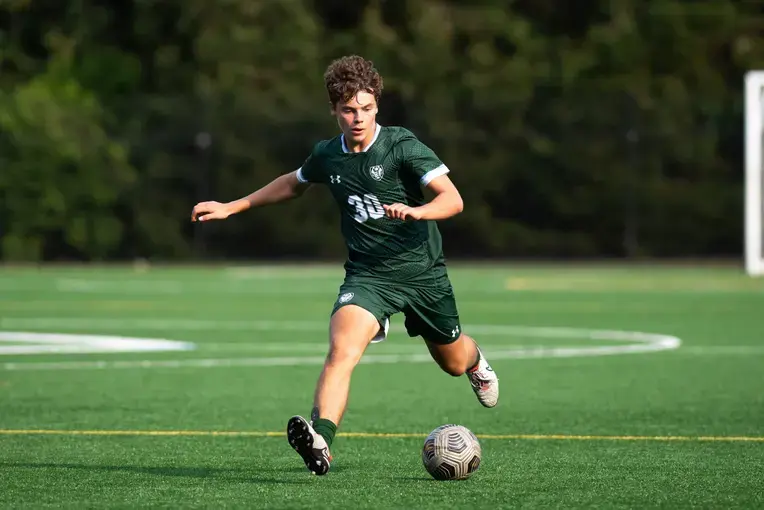 Student playing soccer