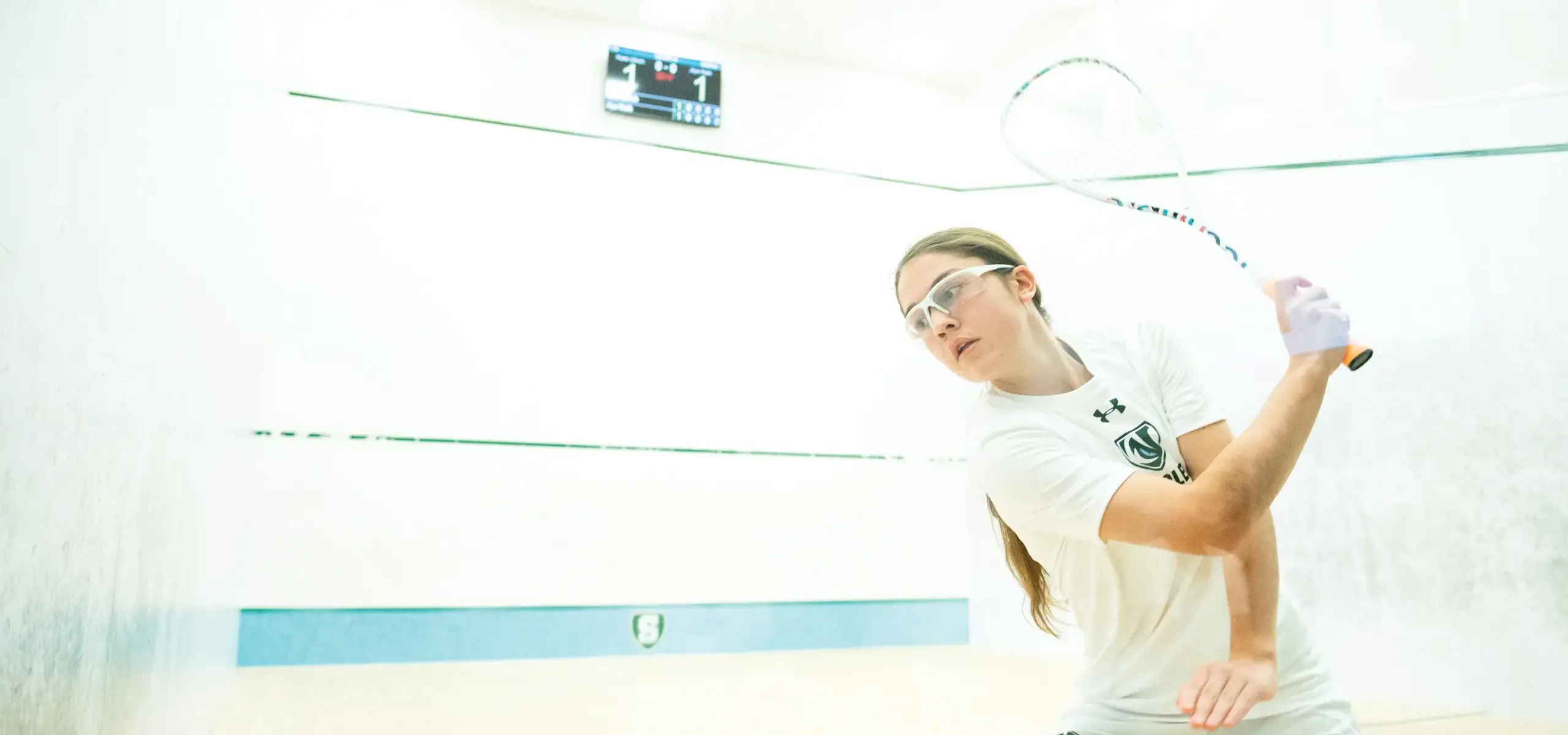 Student playing squash