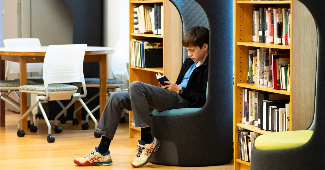 Student reading in library
