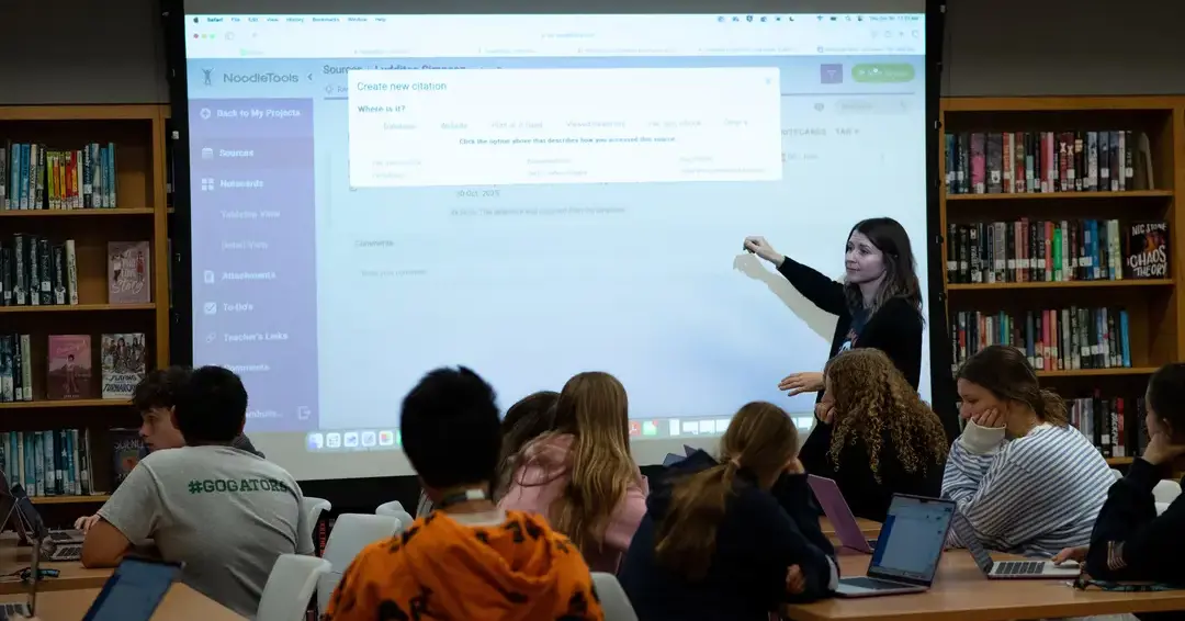 Teacher conducting lesson in library