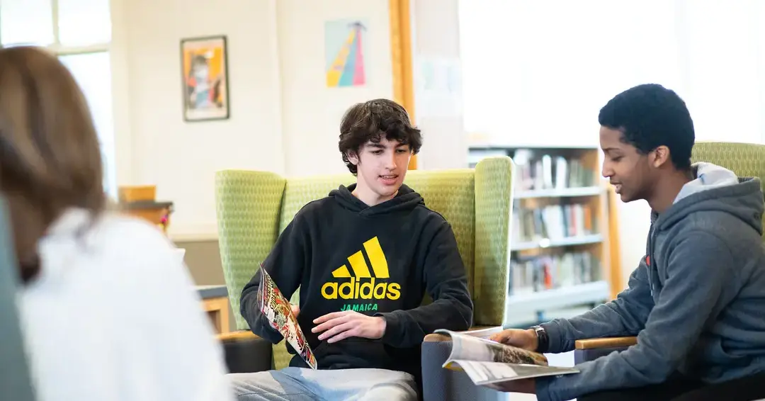 Students discussing in library