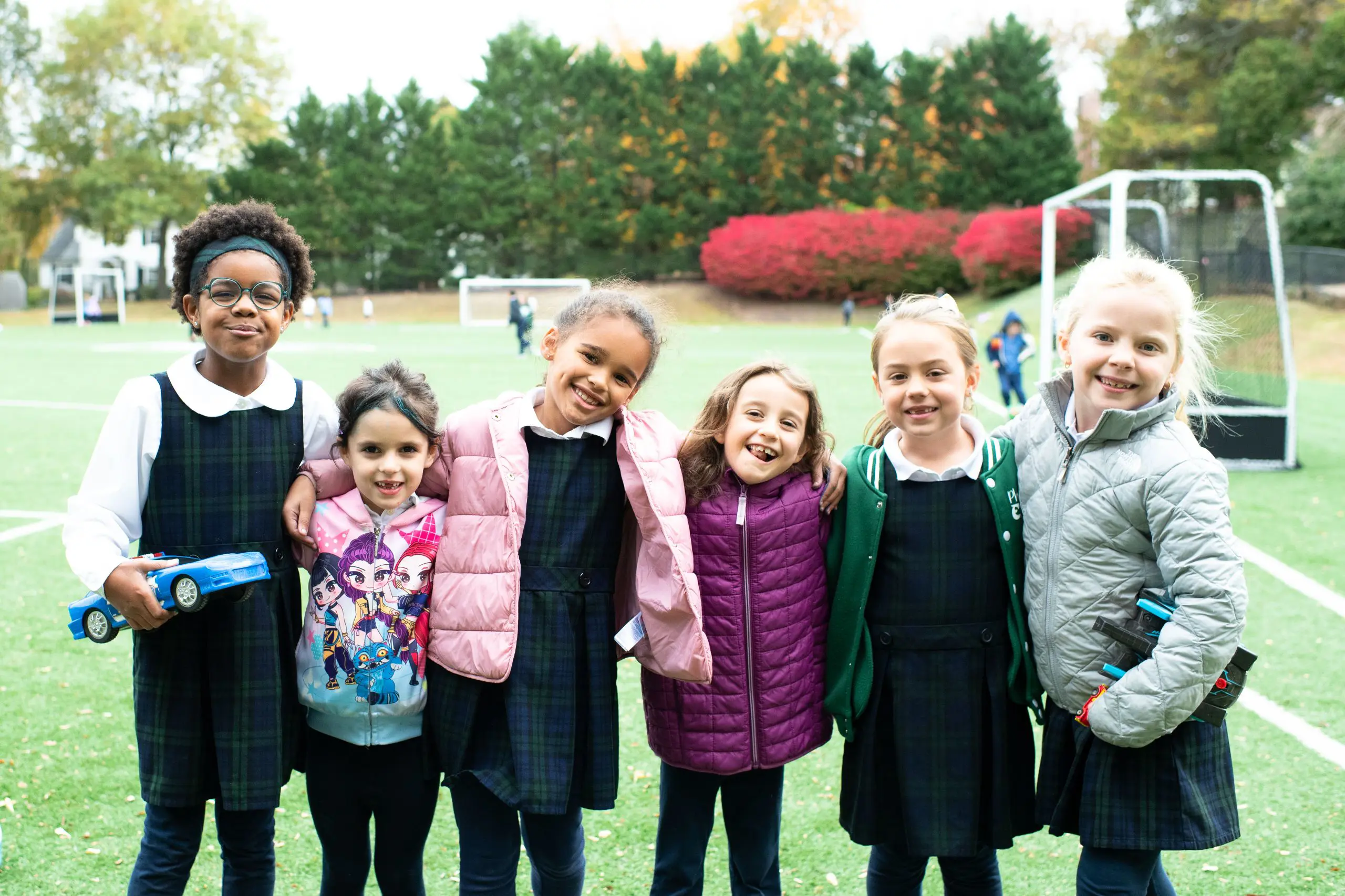 Diverse group of students on soccer field