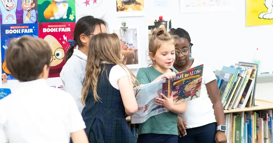 Students in library reading together