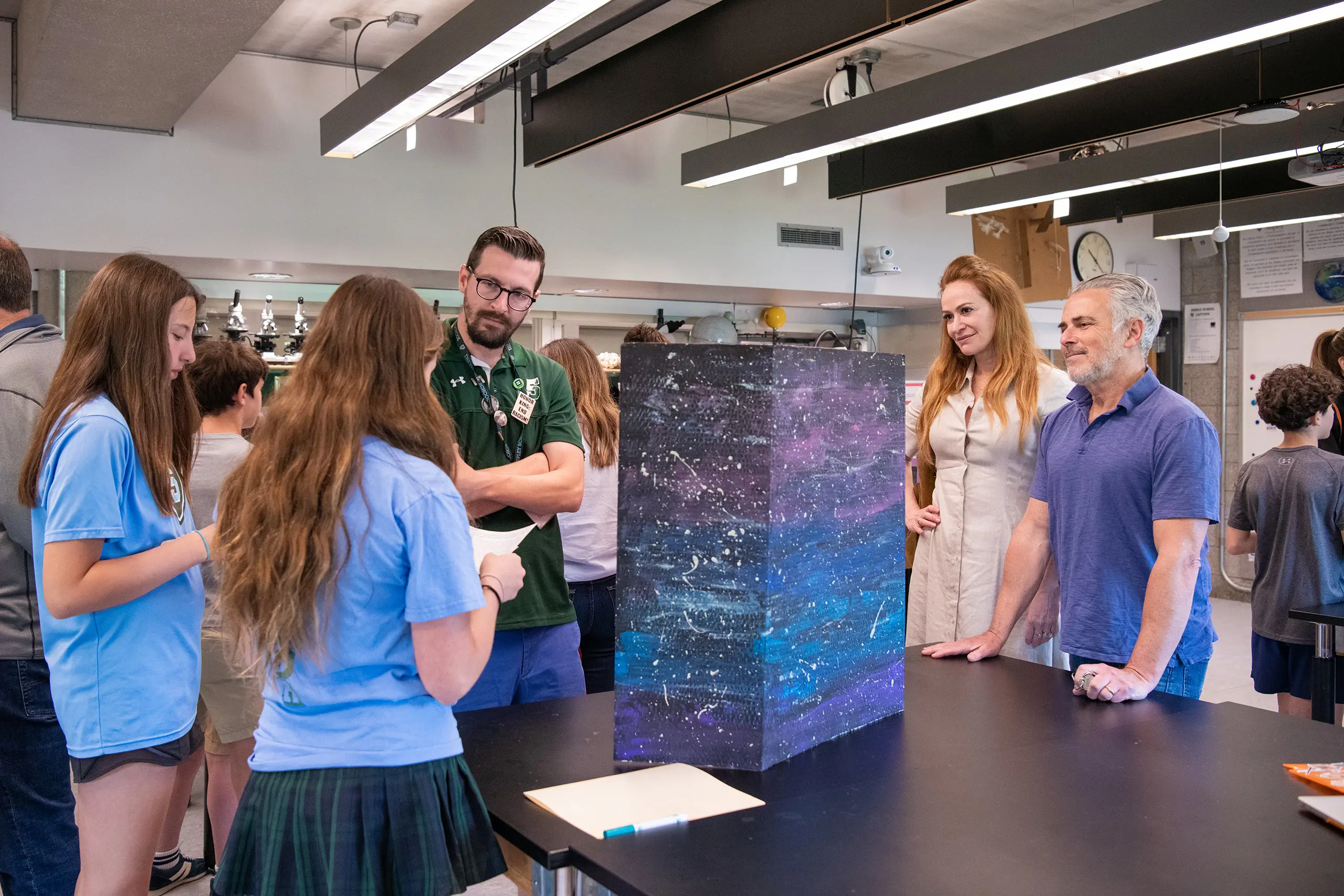 Students and teachers observing project