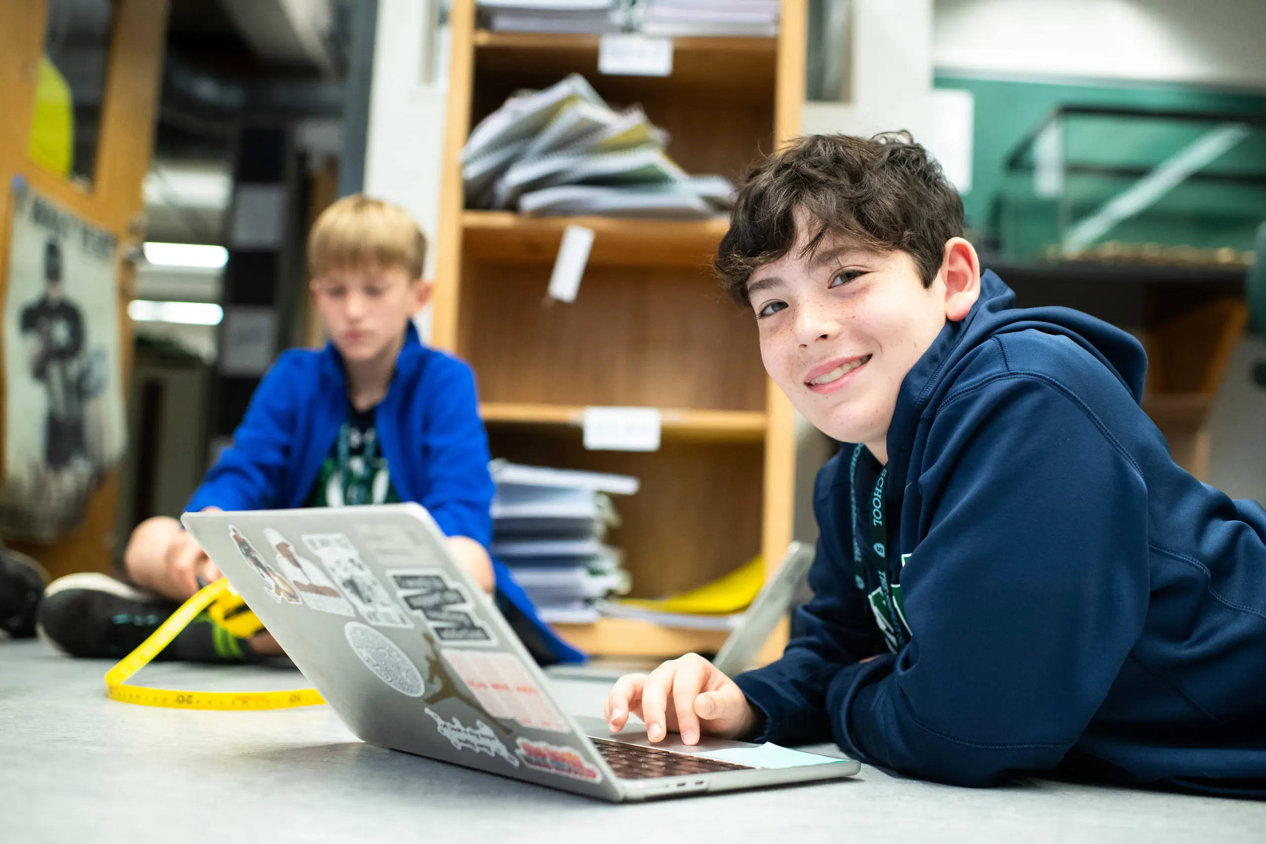 Middle school students on laptops