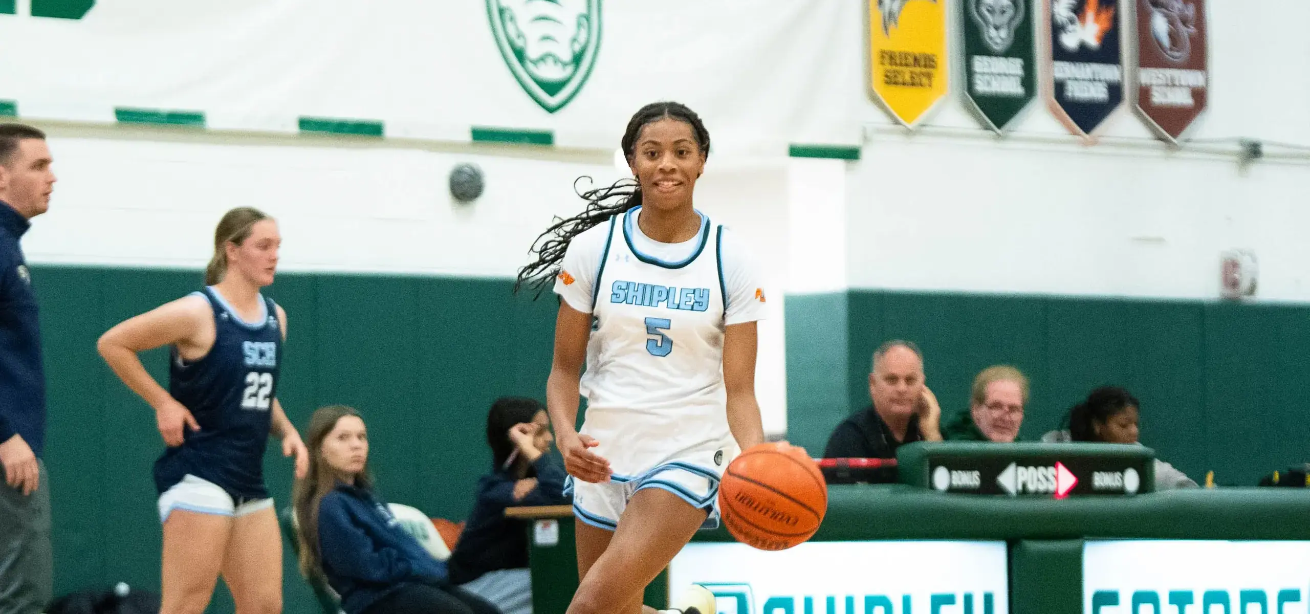 Student playing basketball