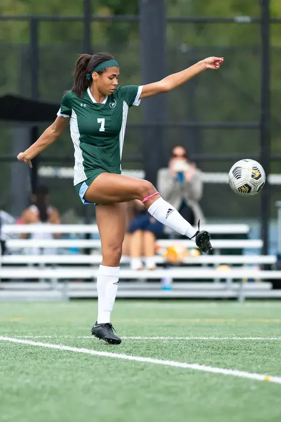 Student playing soccer