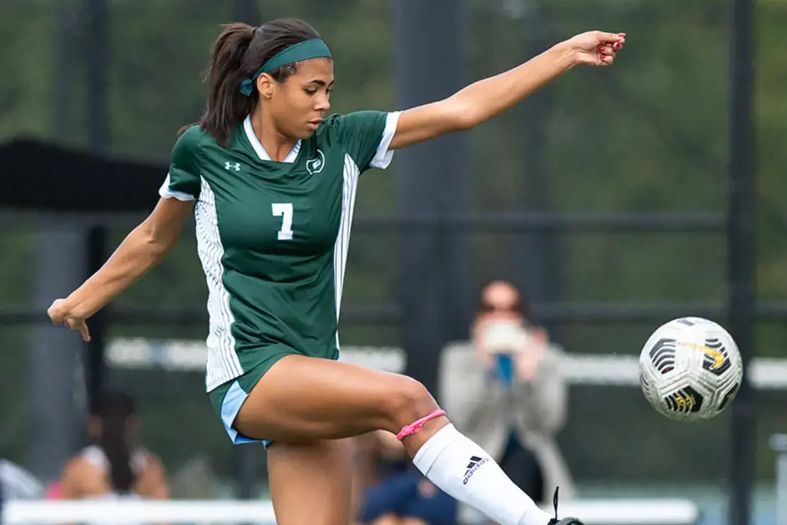 Student playing soccer