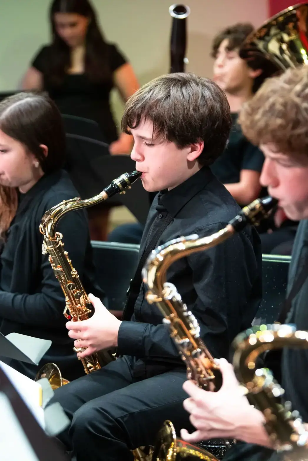 Students playing saxophones