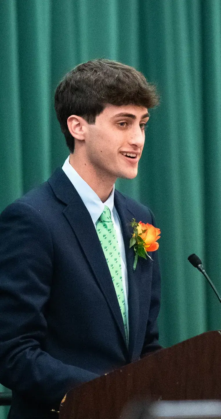 Student speaking at podium