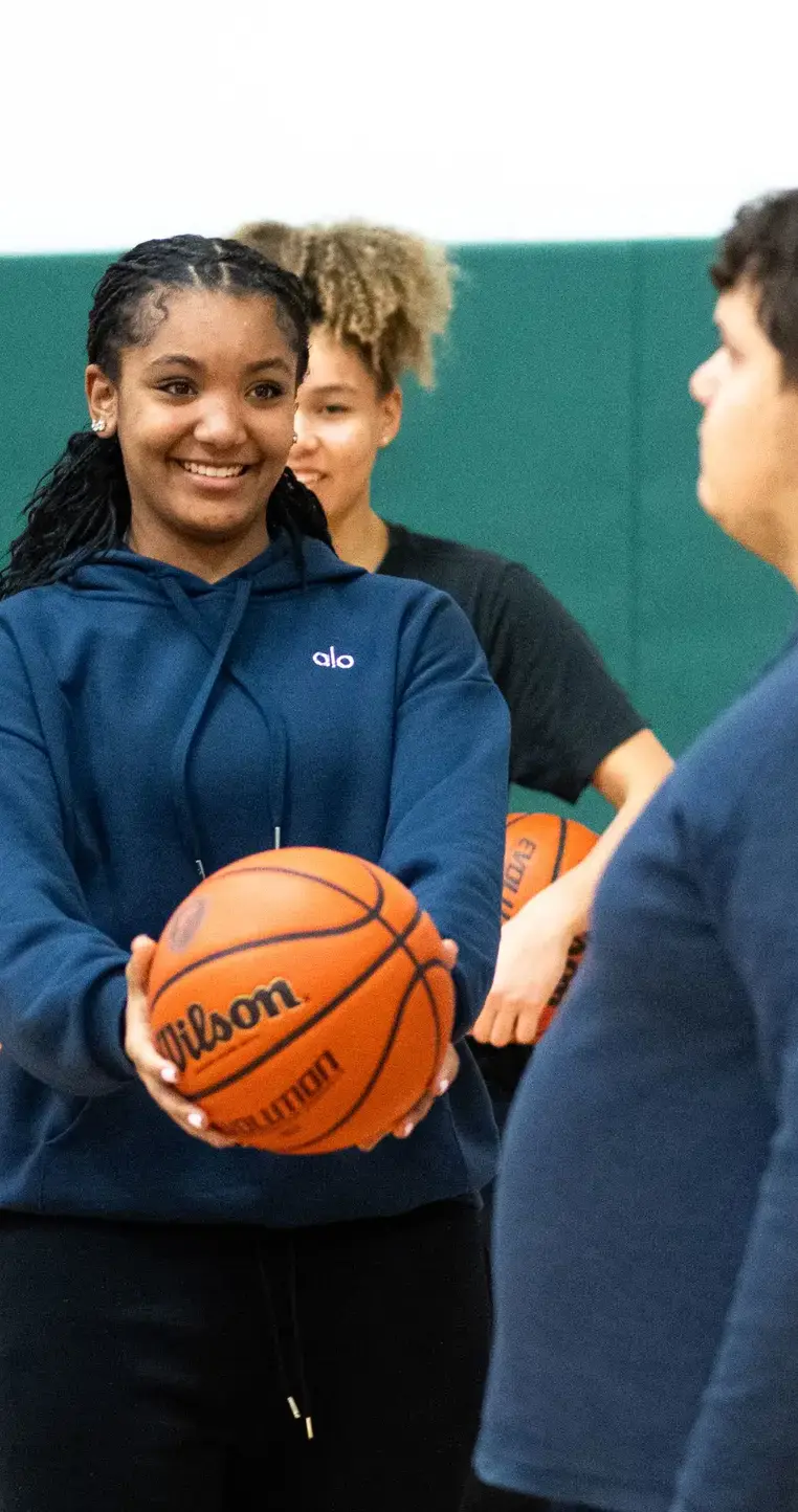 Student holding basketball