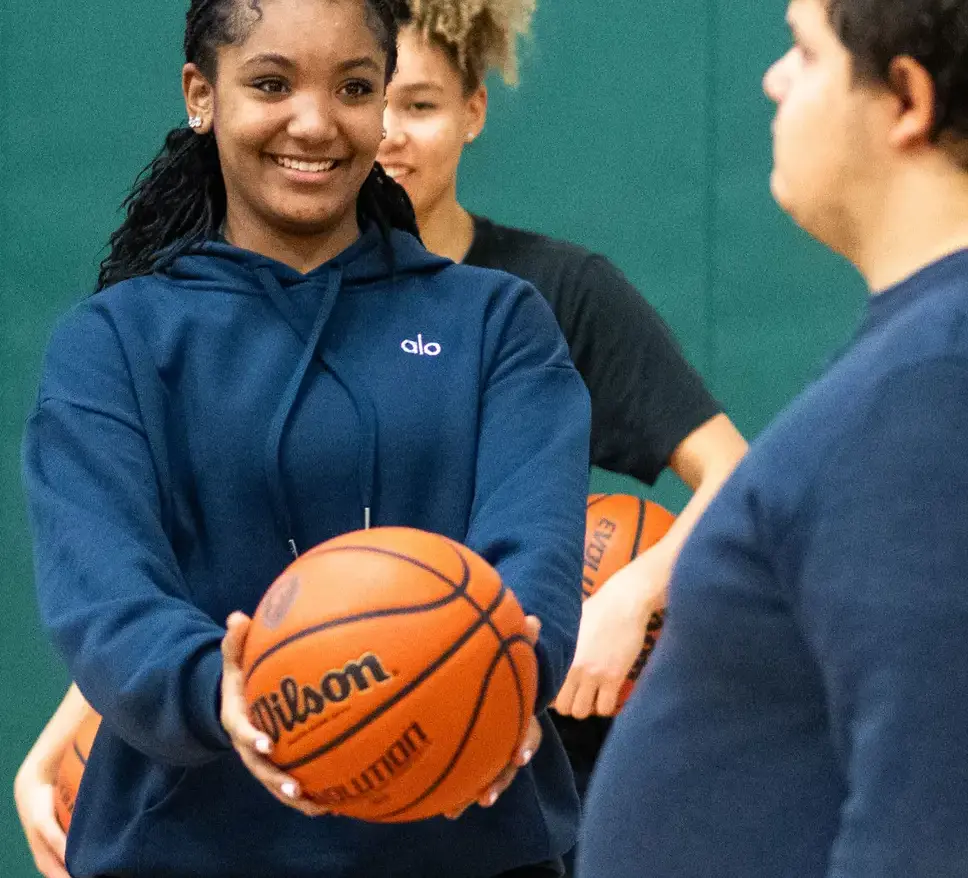 Student holding basketball
