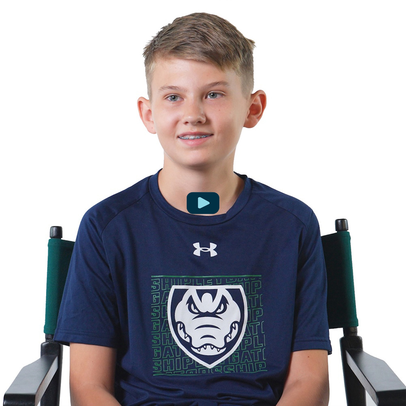 Photo of boy sitting in chair