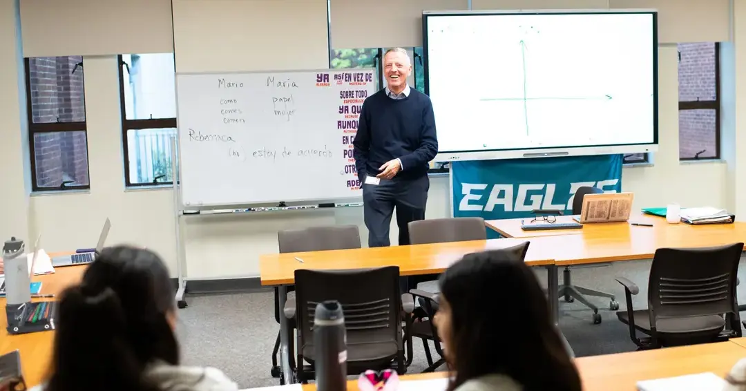 Teacher conducting class with students