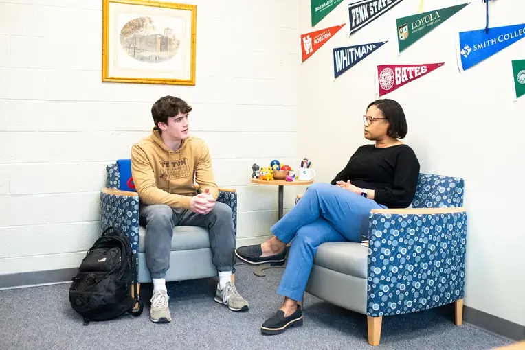 Student with college counselor