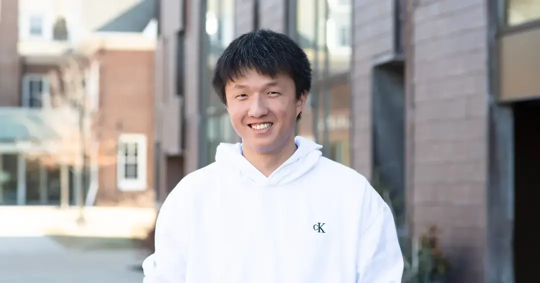 Student in front of campus