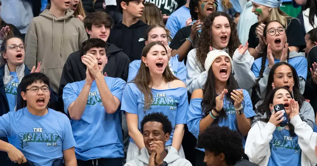 Students cheering during sports game