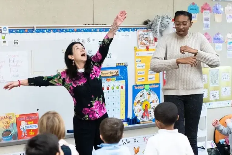 Teachers in class with students