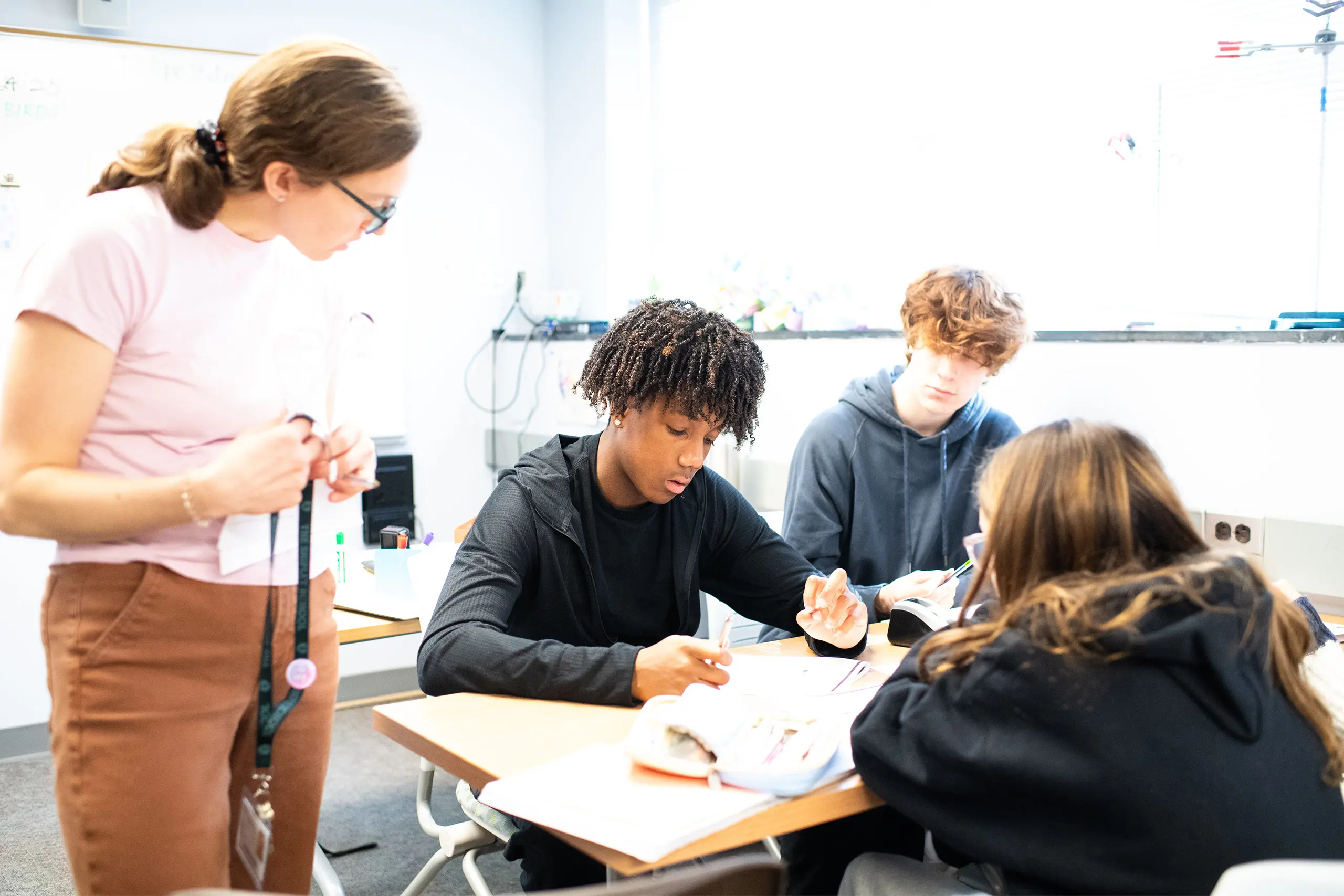 Eliza Varner helping students in class