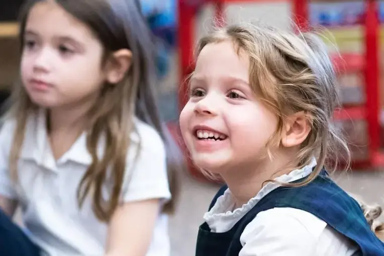 Student smiling and enjoying class