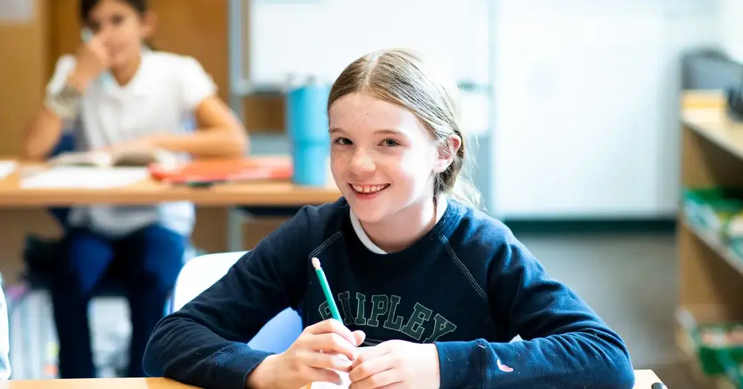 Female student taking notes in class