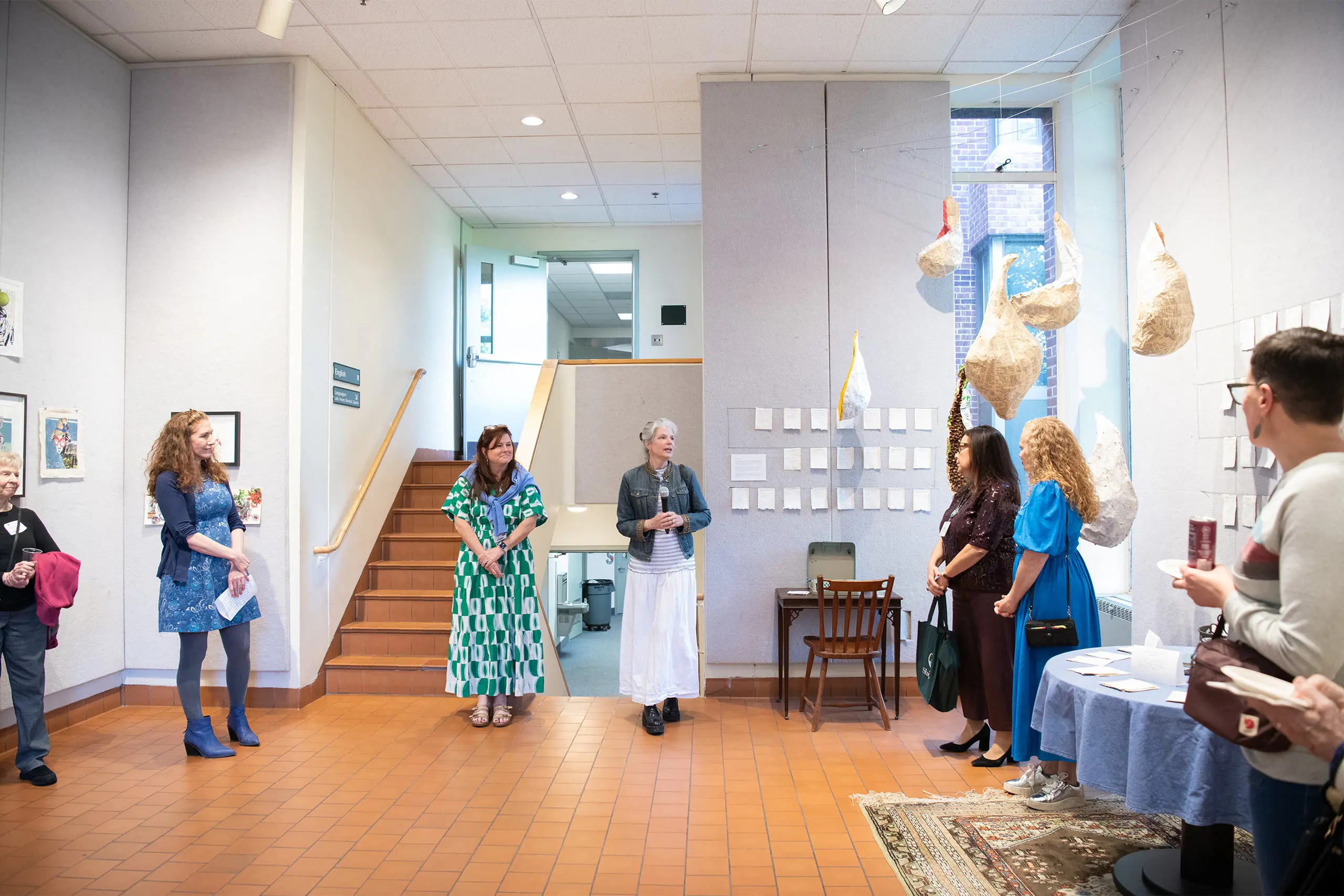 People viewing art exhibition
