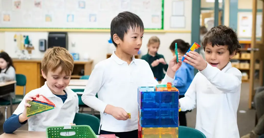 Lower school students in class playing together