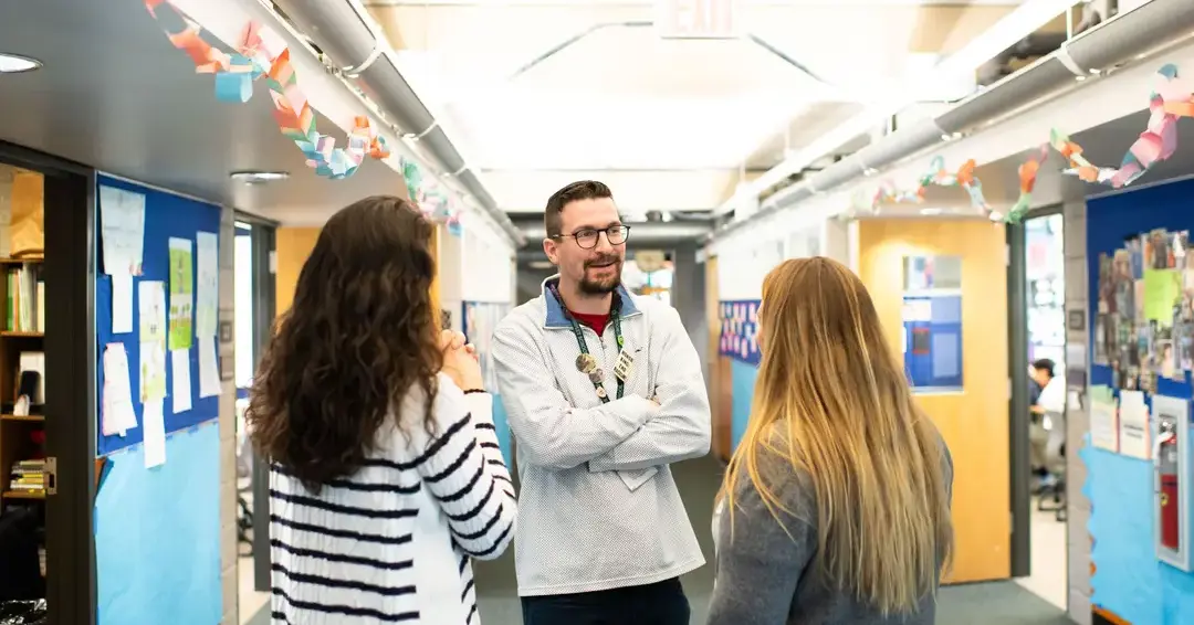 Teacher discussing with students