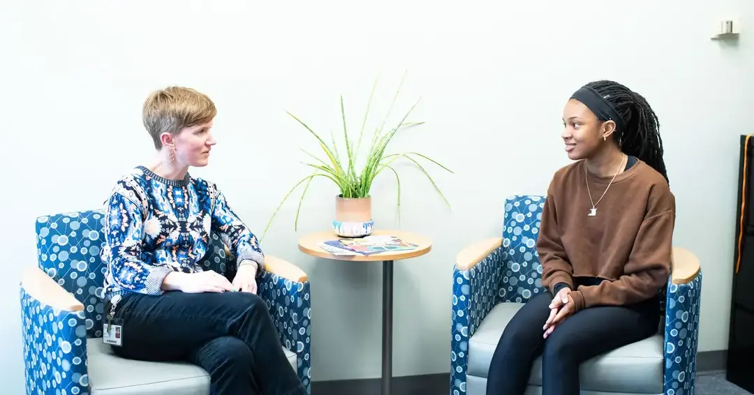 College counselor discussing with student