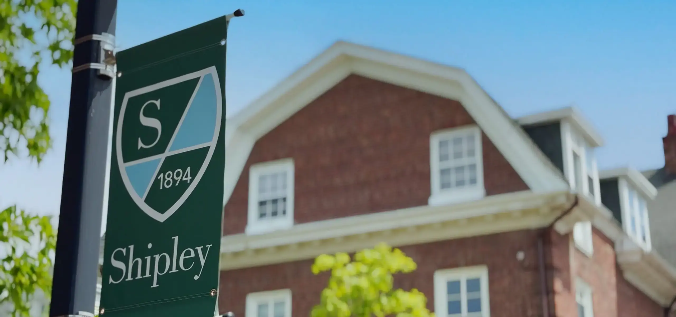 Shipley logo on banner in front of main campus building
