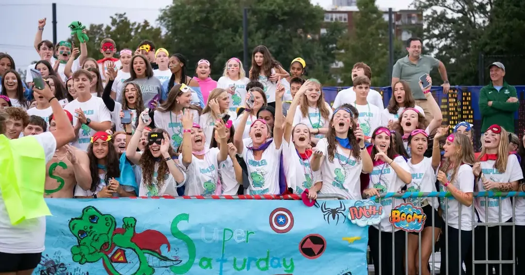Students cheering on sports team